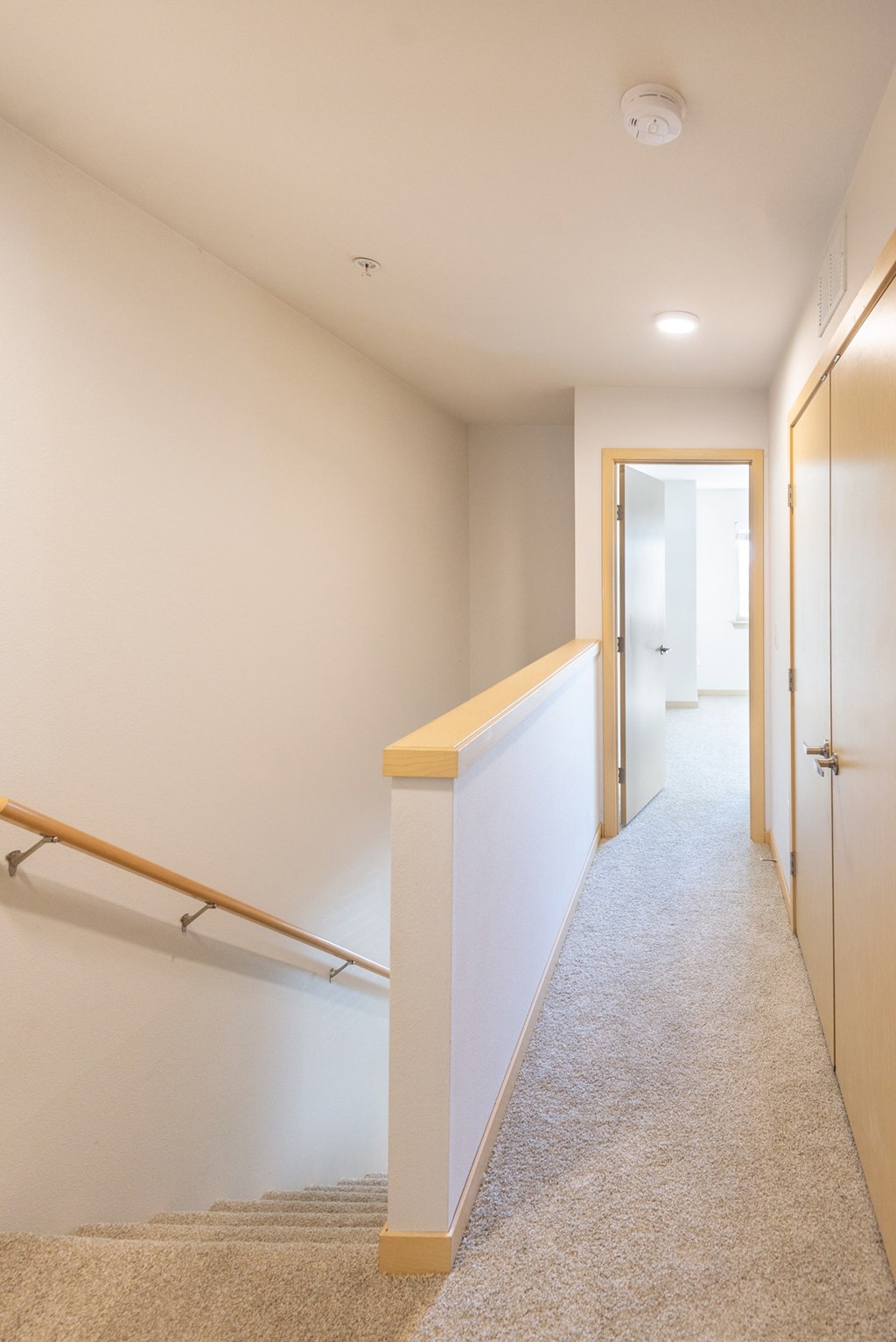 a look down the hall from the top of the stairs in a 555 waverly unit