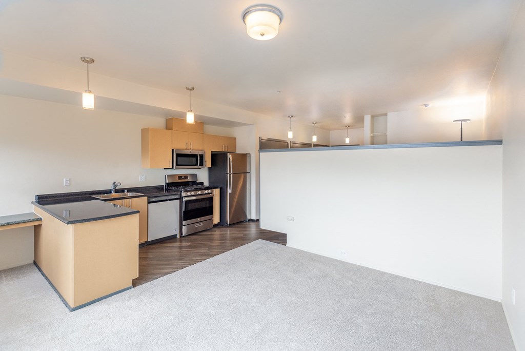 the living room and kitchen in a 750 sq ft apartment
