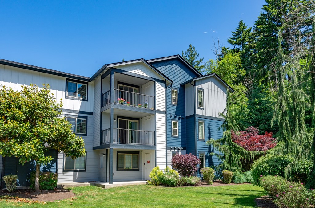 A large two-story house with a balcony on the second floor.