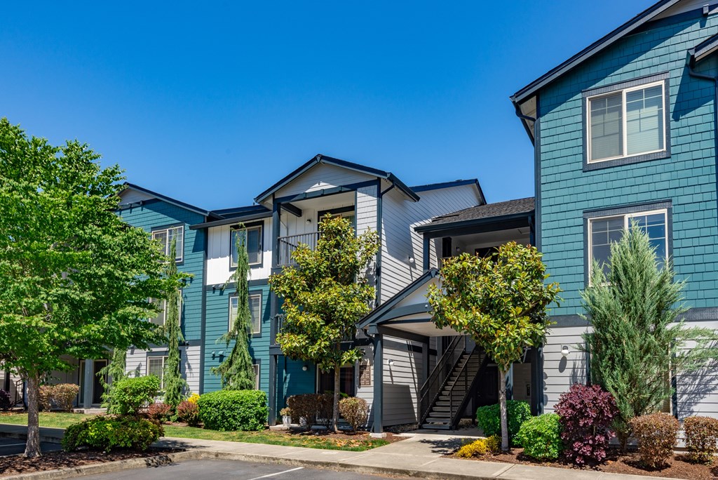 A blue building with a white door and windows.