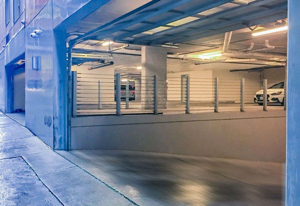the inside of a parking garage with a car in it