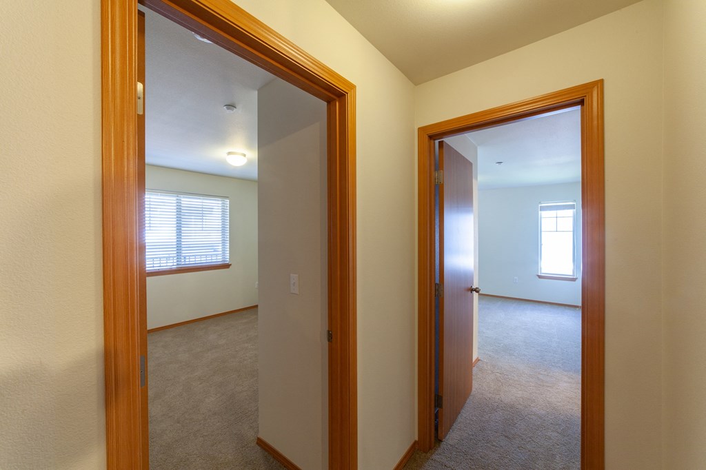 the view of a living room and a bedroom from a doorway