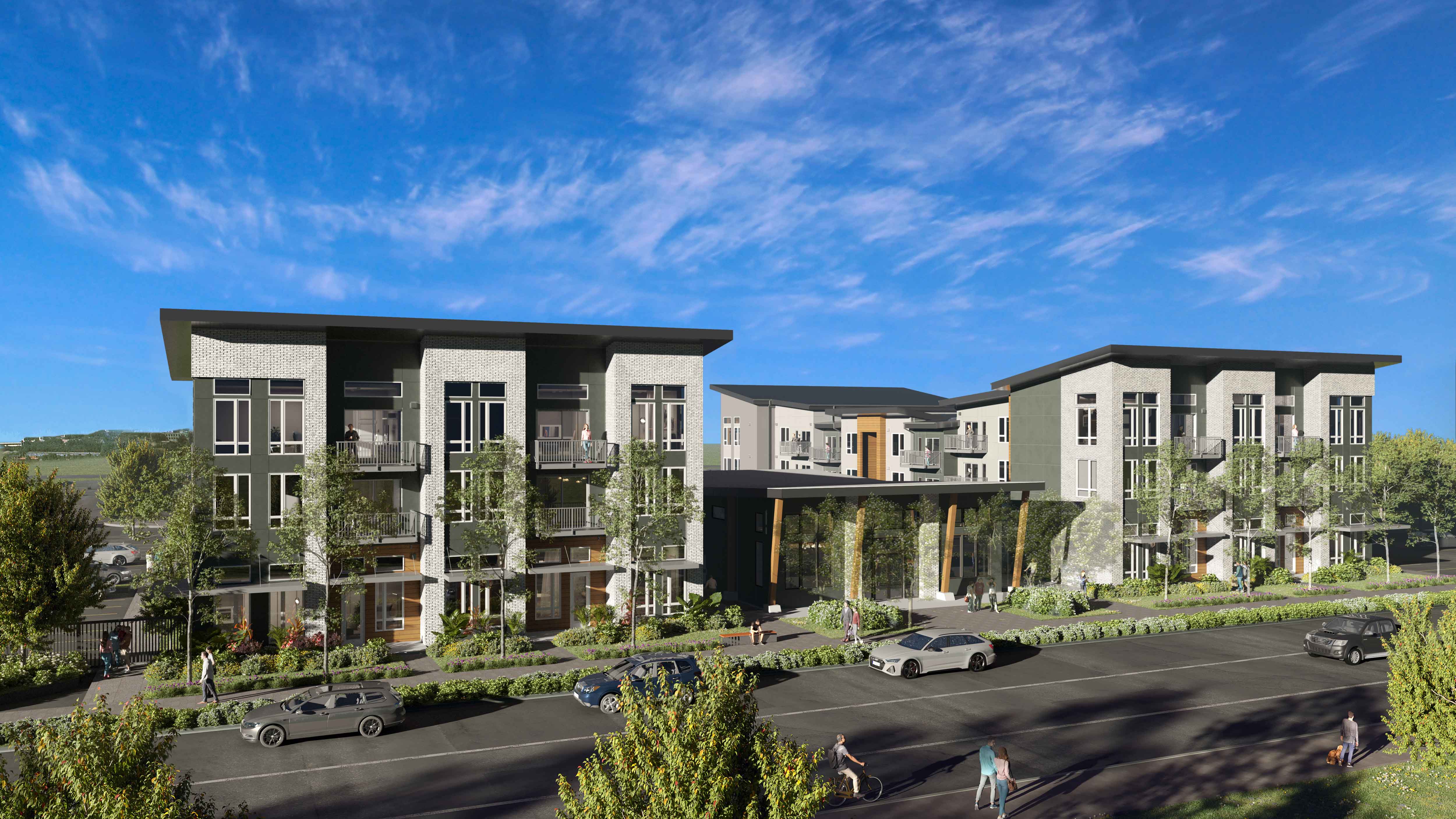 A modern apartment complex with a parking lot in front.
