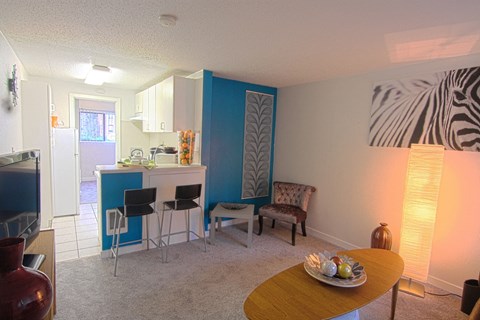 a living room with a dining room and a kitchen