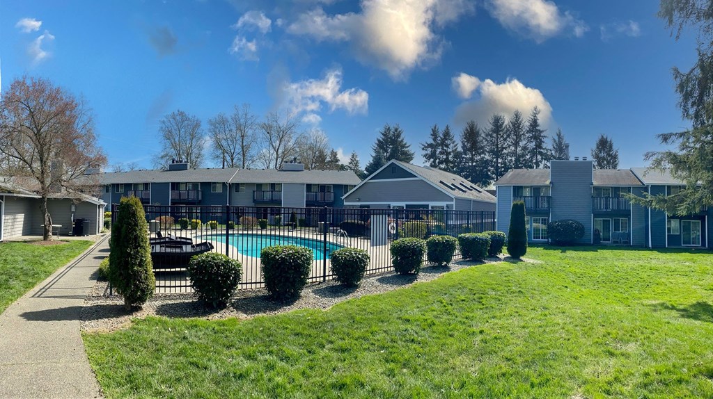 a view of a swimming pool in front of a building