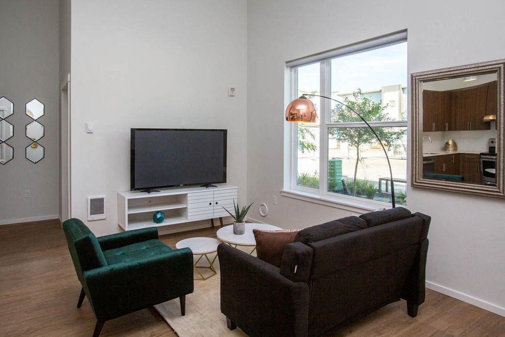 a living room with a couch and a television