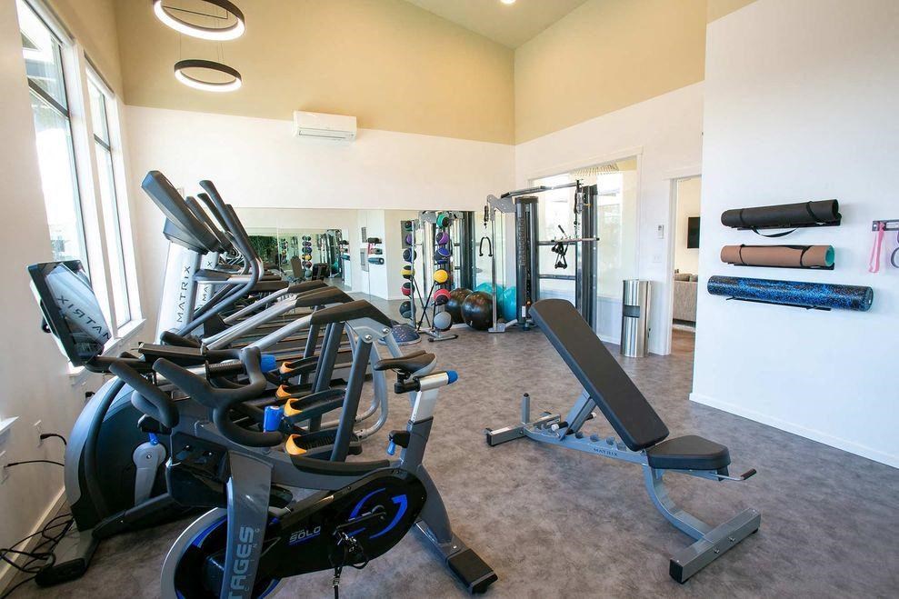 a gym with various pieces of exercise equipment