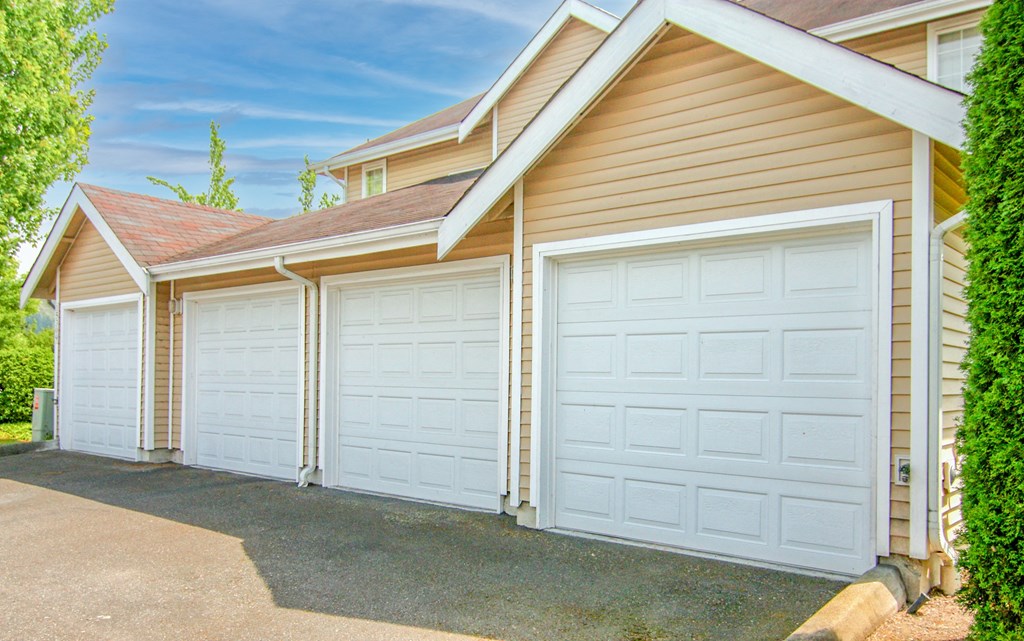 a row of garage doors on the side of a house