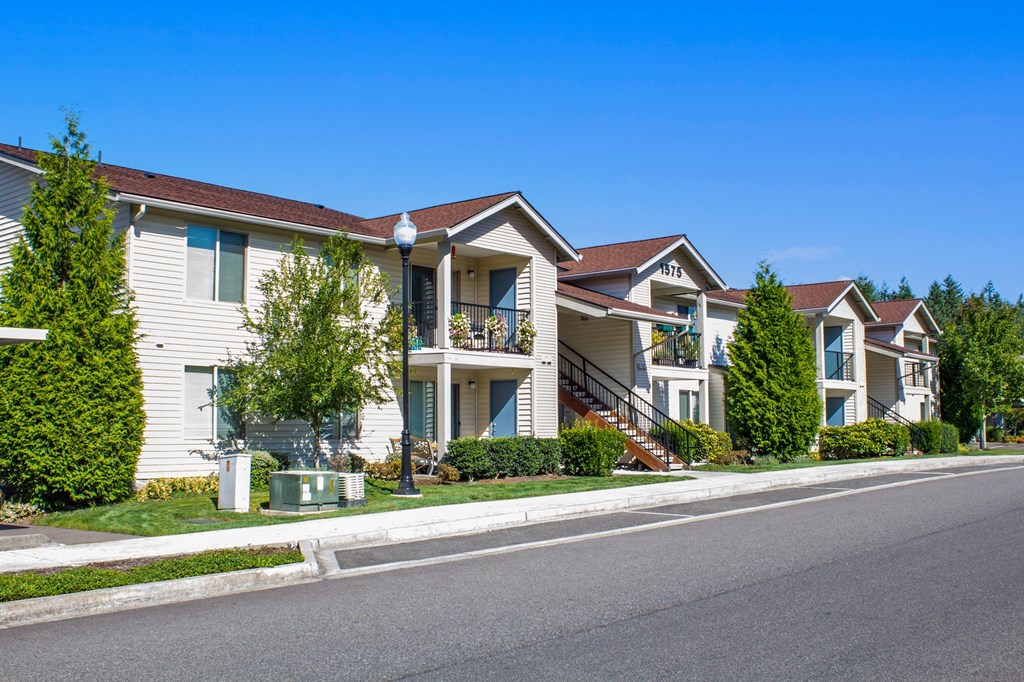 a row of houses on the side of a street