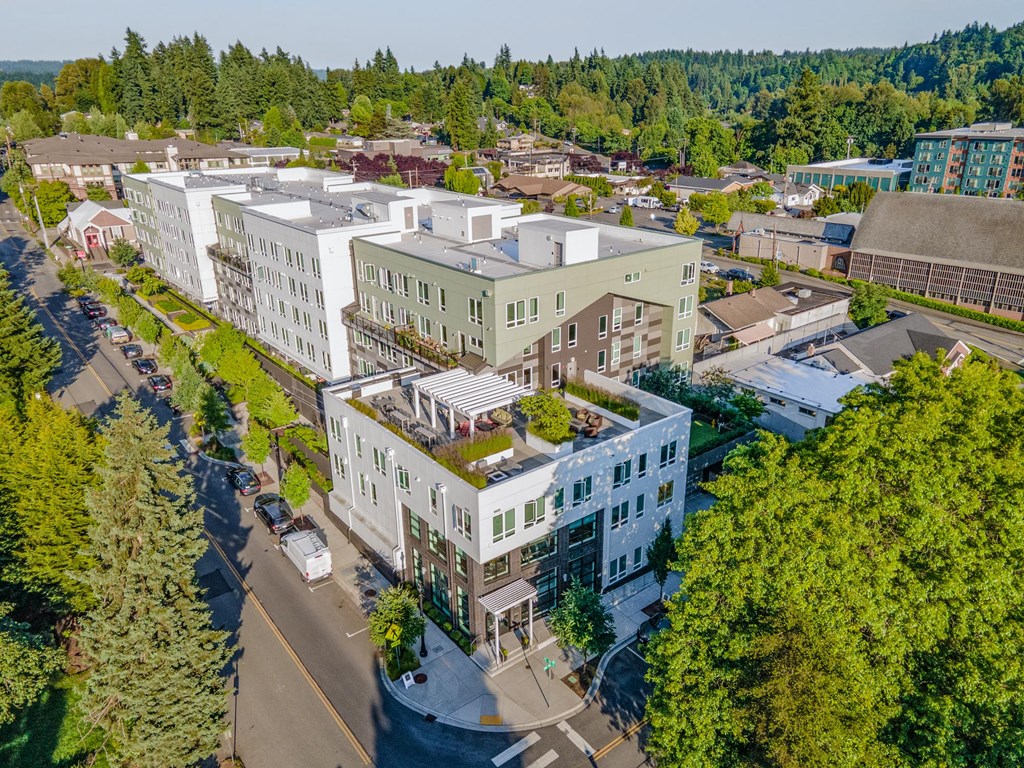 an aerial view of a city with buildings and trees
