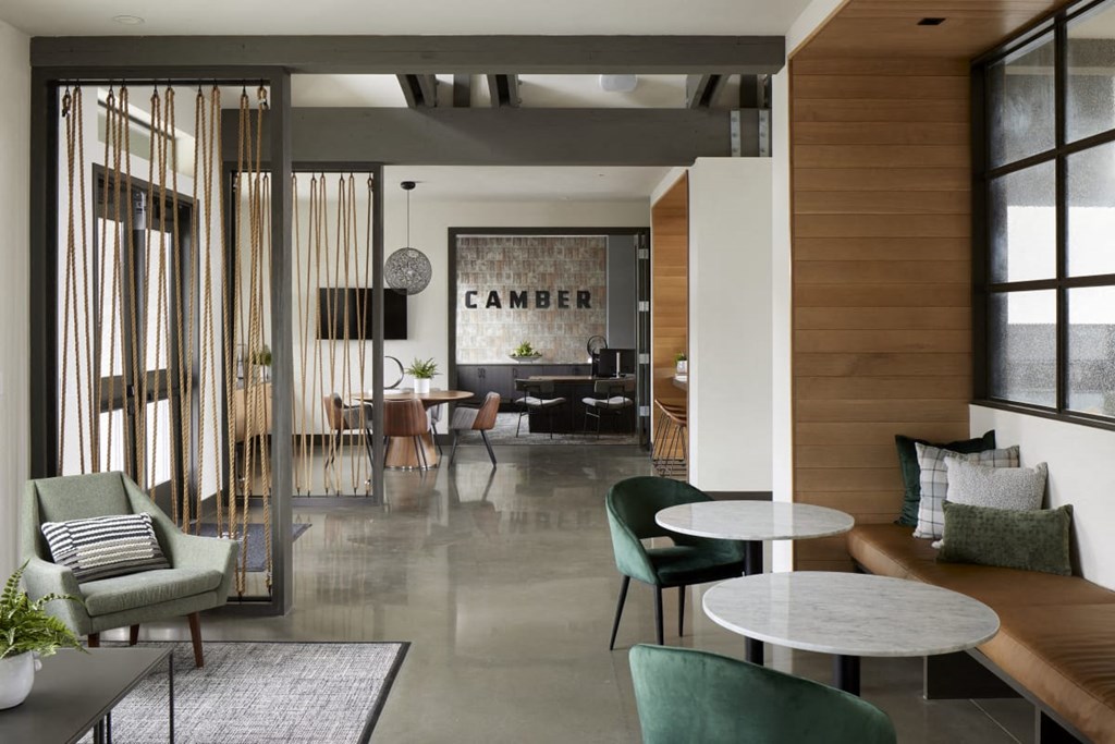 a room filled with furniture and a large window