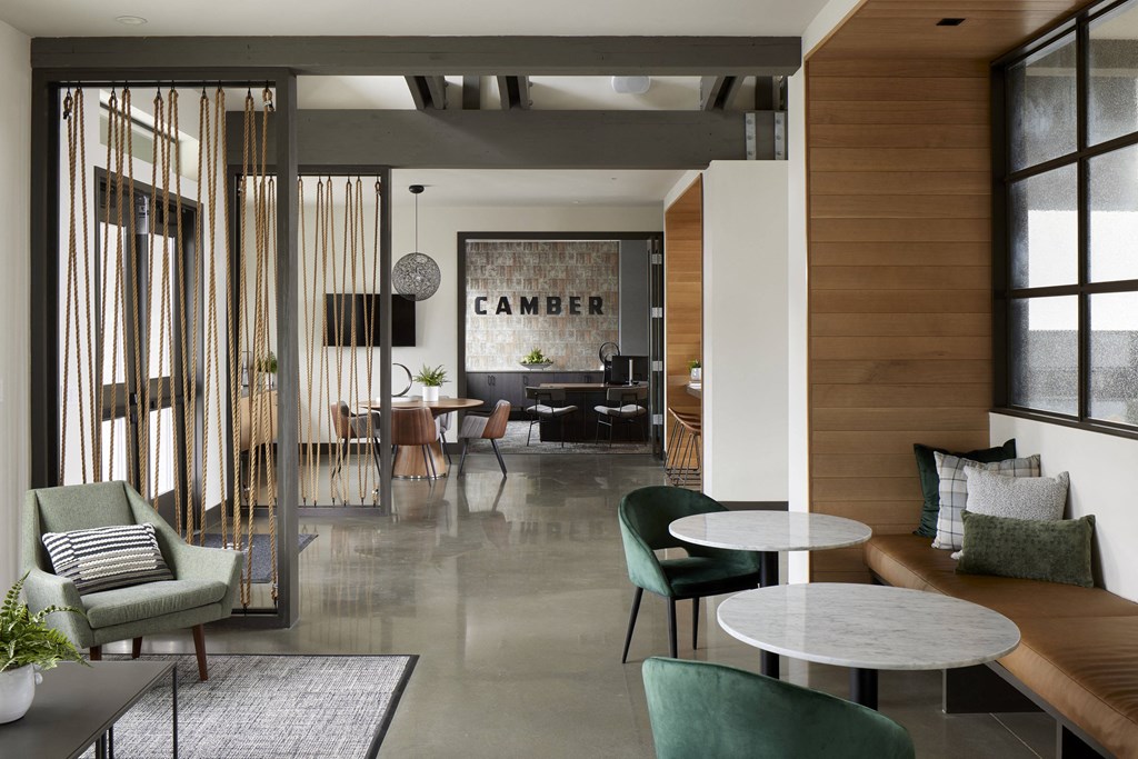 a room filled with furniture and a large window