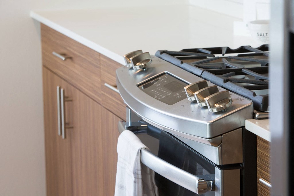 a stainless steel stove and oven in a kitchen
