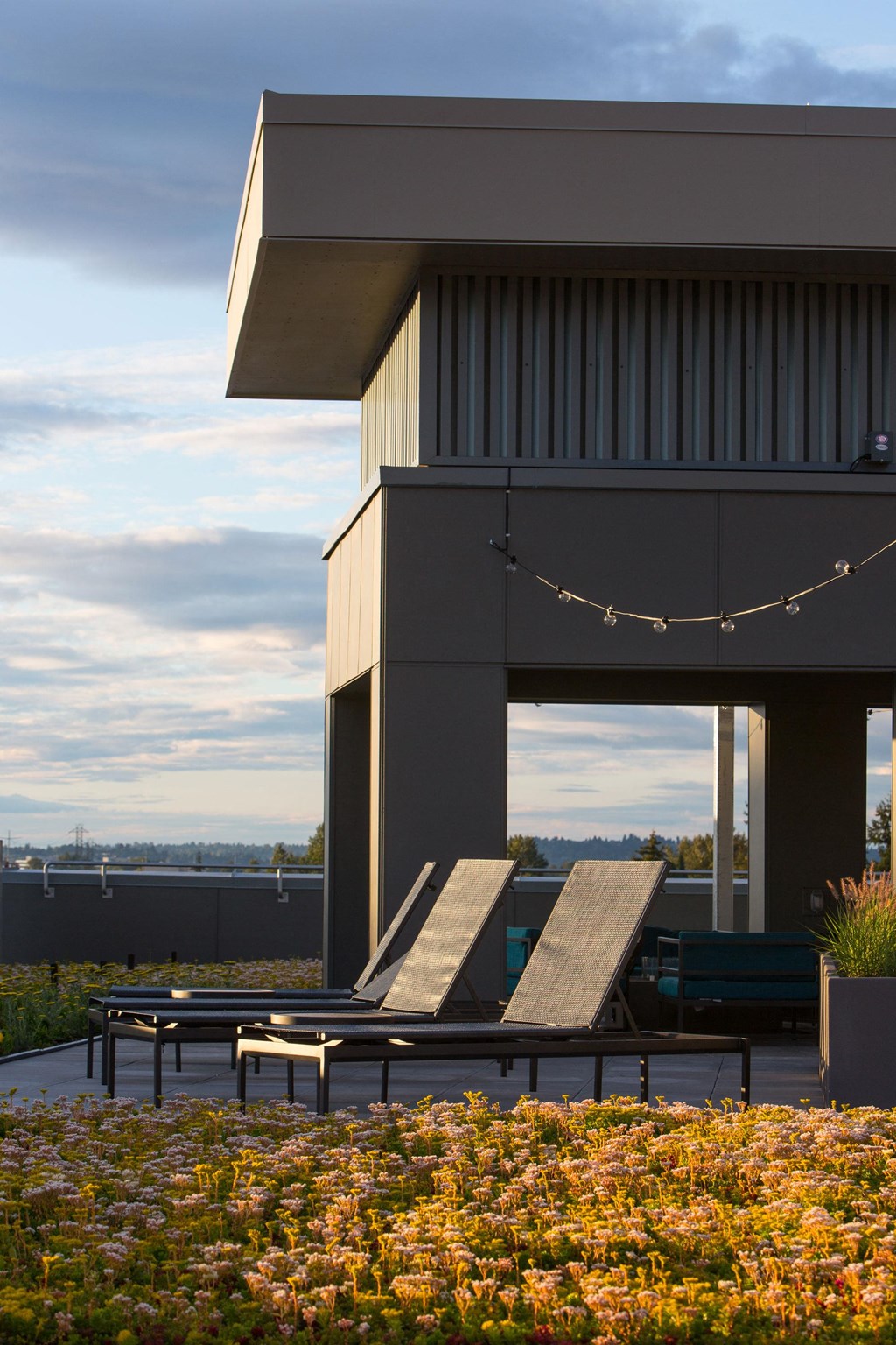 a large building with two wooden benches on a roof