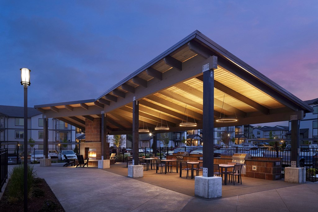 a rendering of a patio with awnings and tables