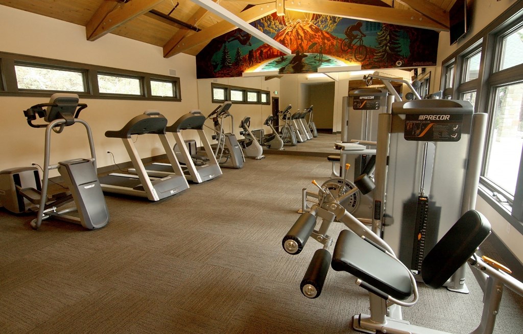 a gym with a variety of exercise equipment
