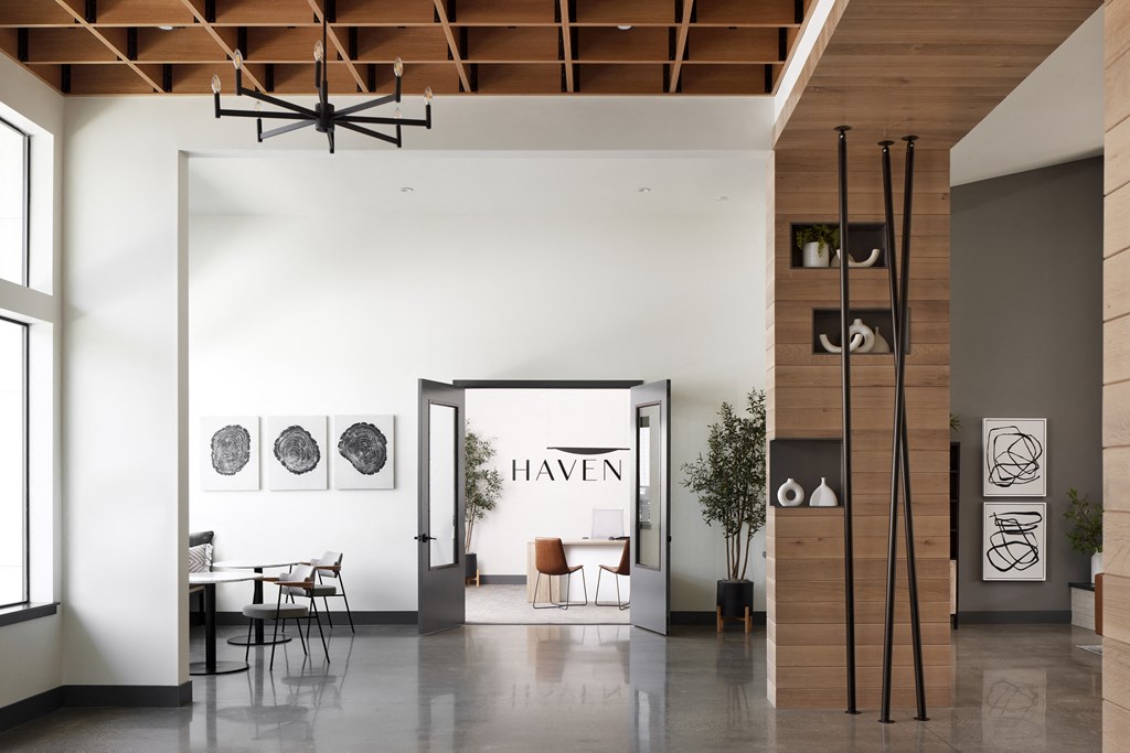 a rendering of a large room with white walls and a large doorway with a sign that reads