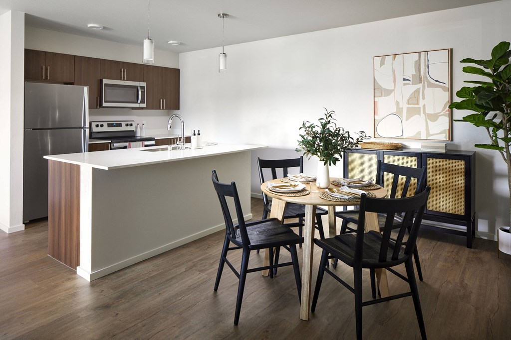 a kitchen and dining area in a 555 waverly unit