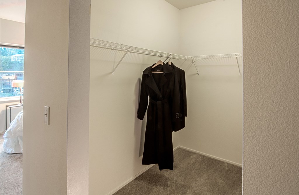 a dressing room with a robe hanging on a hangar