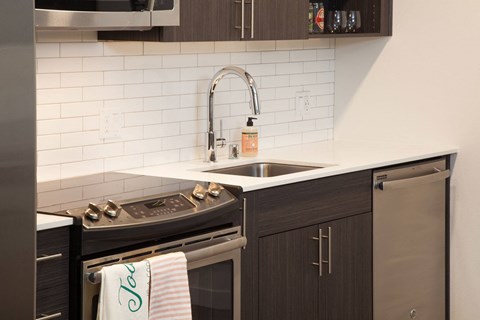 a small kitchen with a sink and a stove