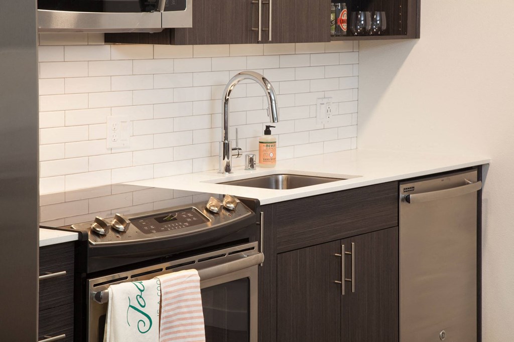a small kitchen with a sink and a stove