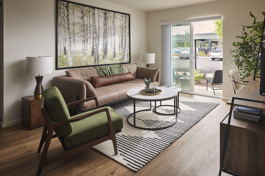 a living room with a couch chair and coffee table