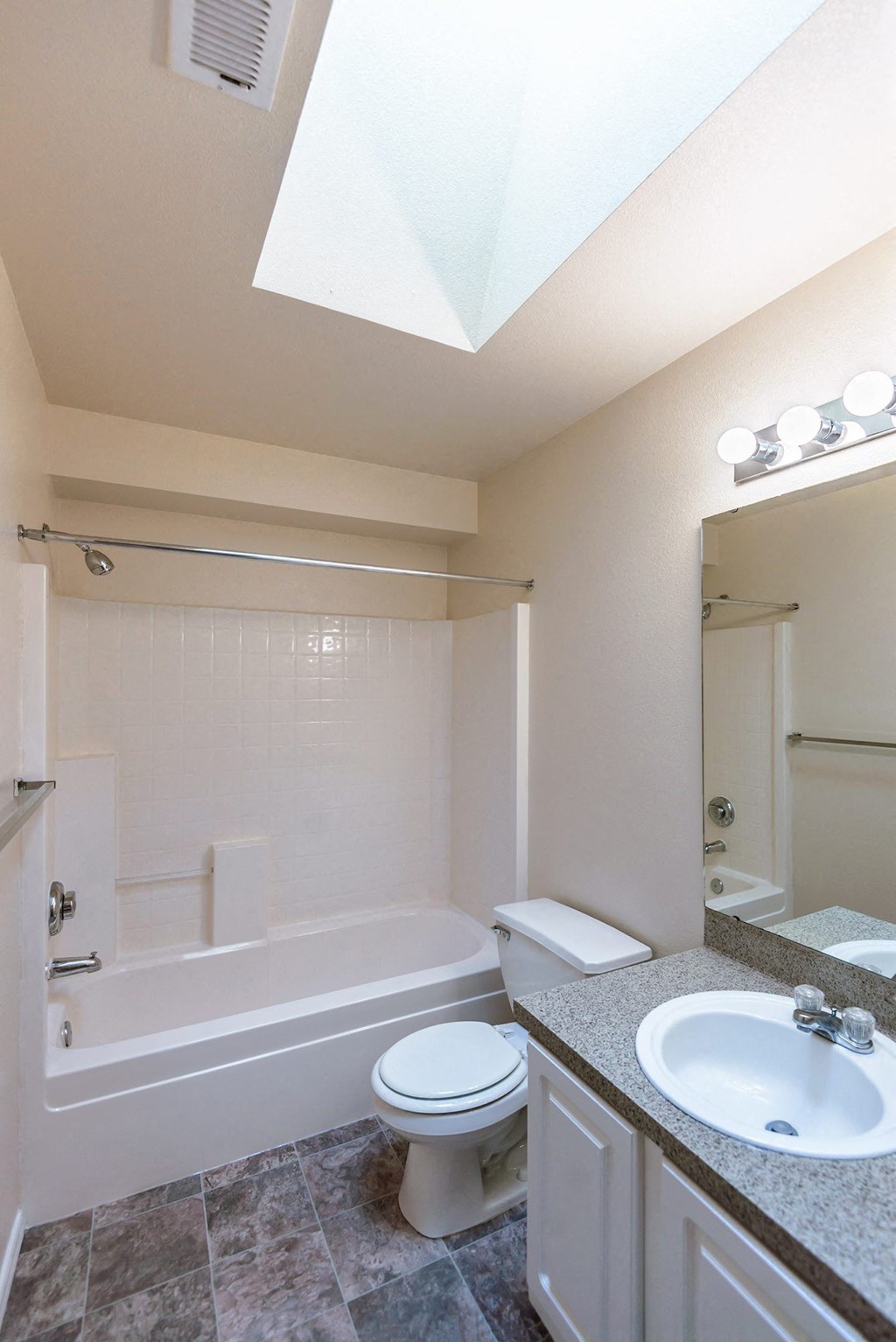 a bathroom with a sink toilet and a bath tub