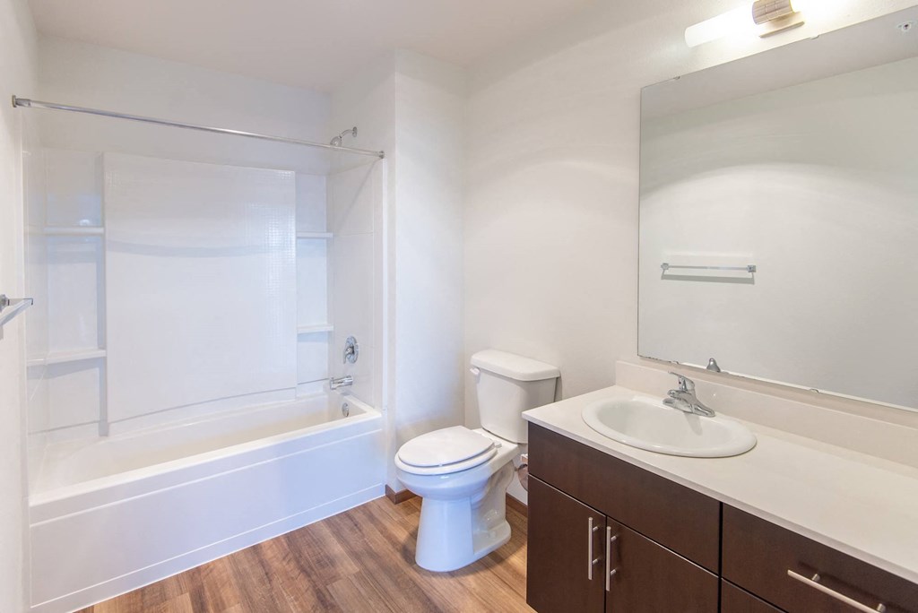 a bathroom with a sink toilet and a bath tub