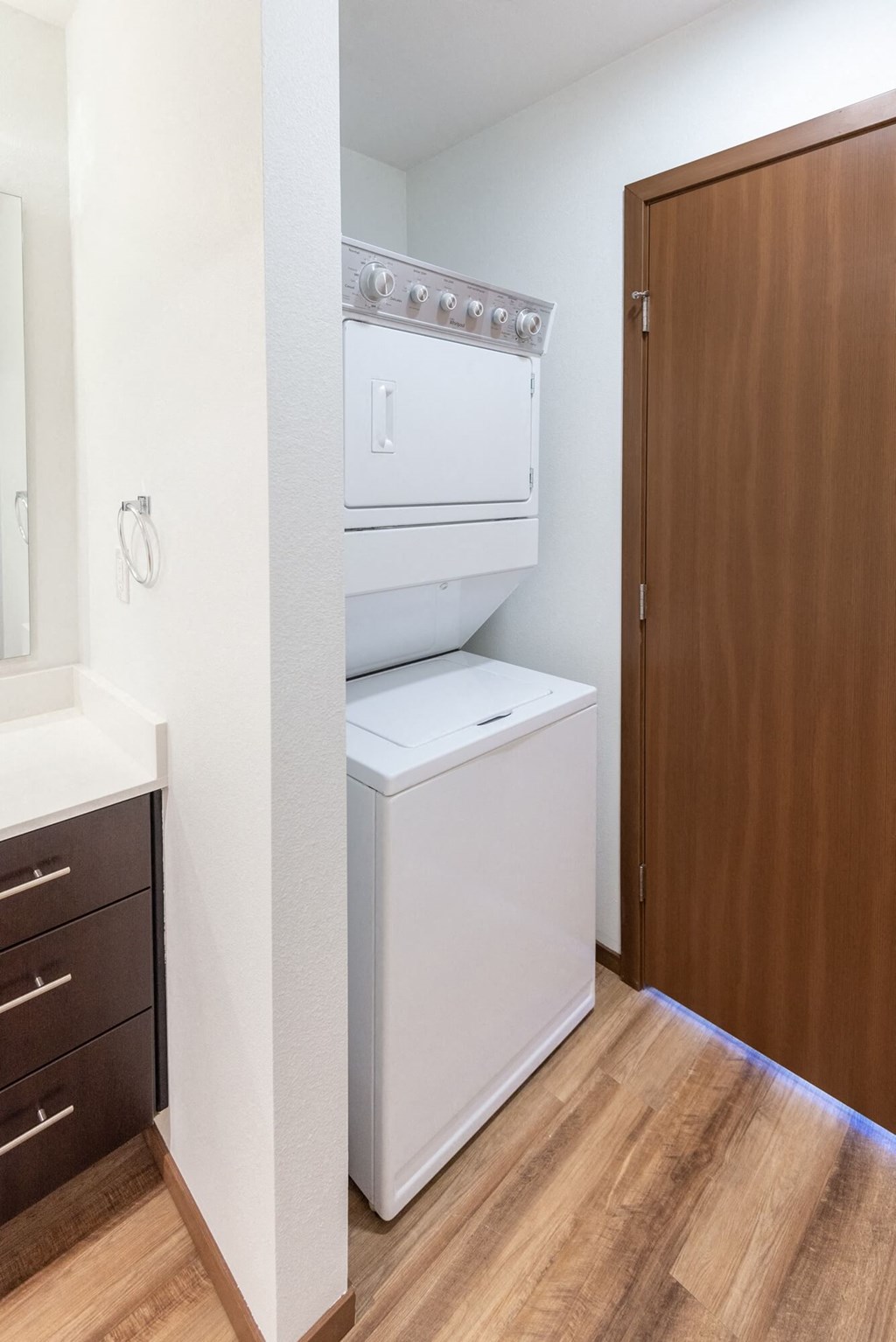 a bathroom with a washer and dryer in a closet