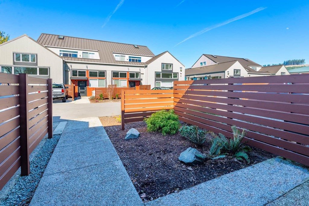 a wooden fence in front of a house