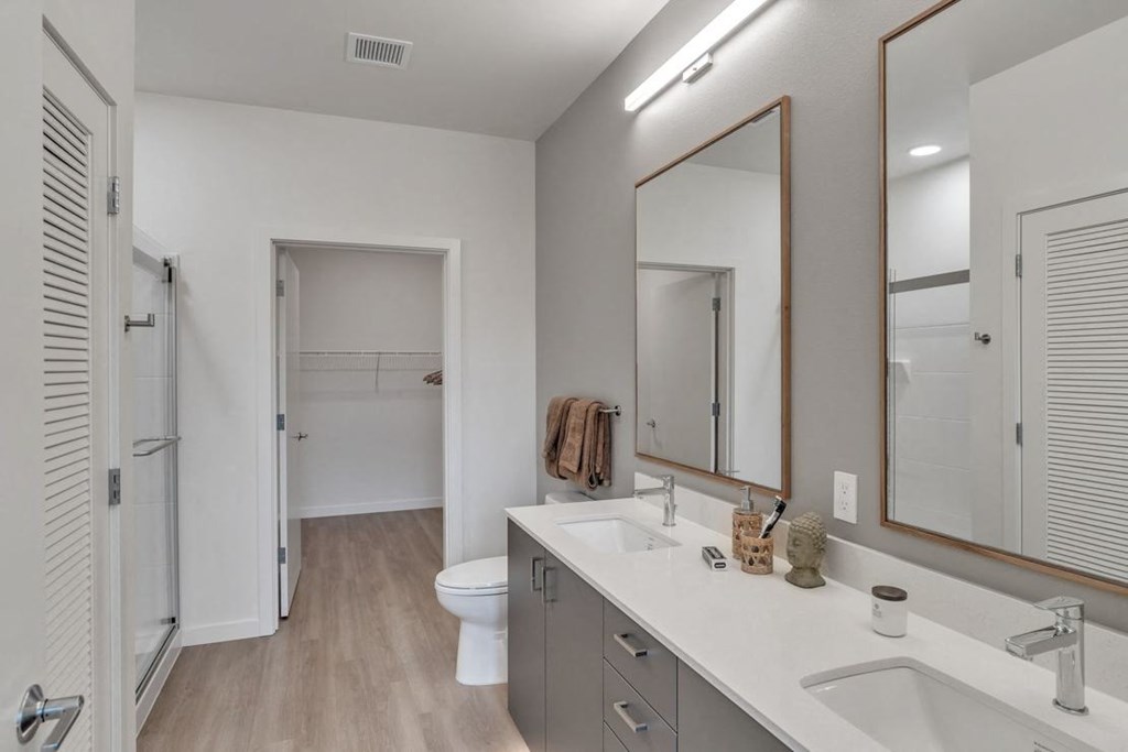 a bathroom with a sink and a toilet and a mirror