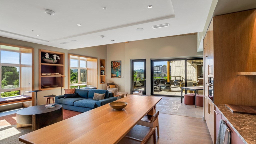 a living room with a couch and a wooden table