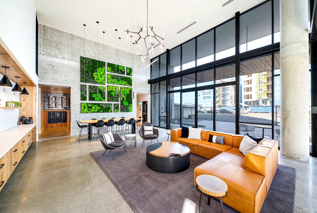 a large living room with a couch and a table