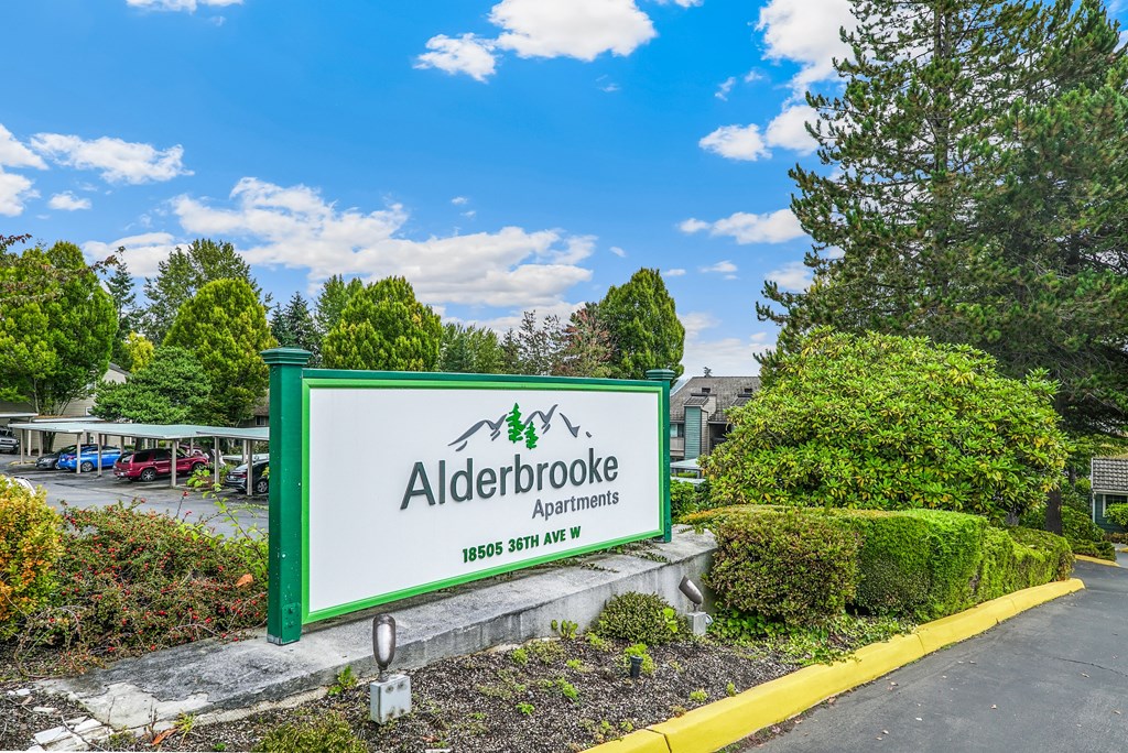 the sign for aaldeveloped apartments in front of a parking lot