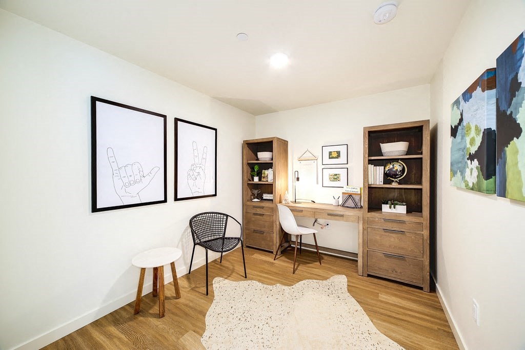 a study area with a desk and a chair in a bedroom
