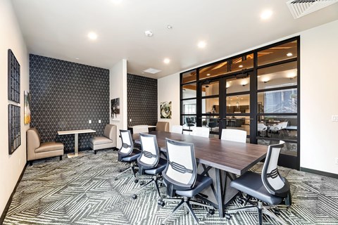 a conference room with a large table and chairs
