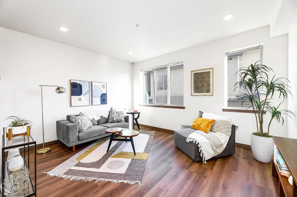 a living room with two couches and a table