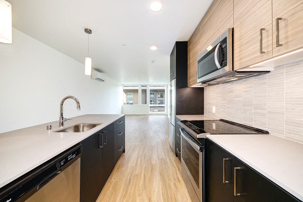 a kitchen with a sink and a microwave