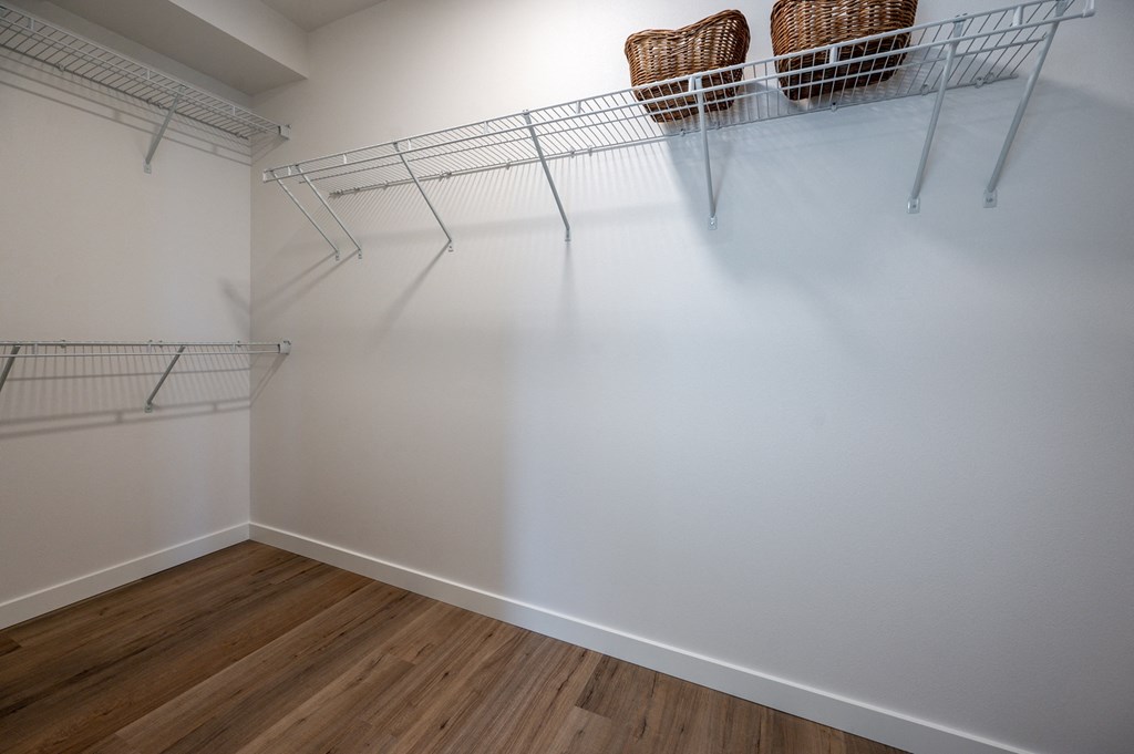 a large walk in closet in a 555 waverly unit