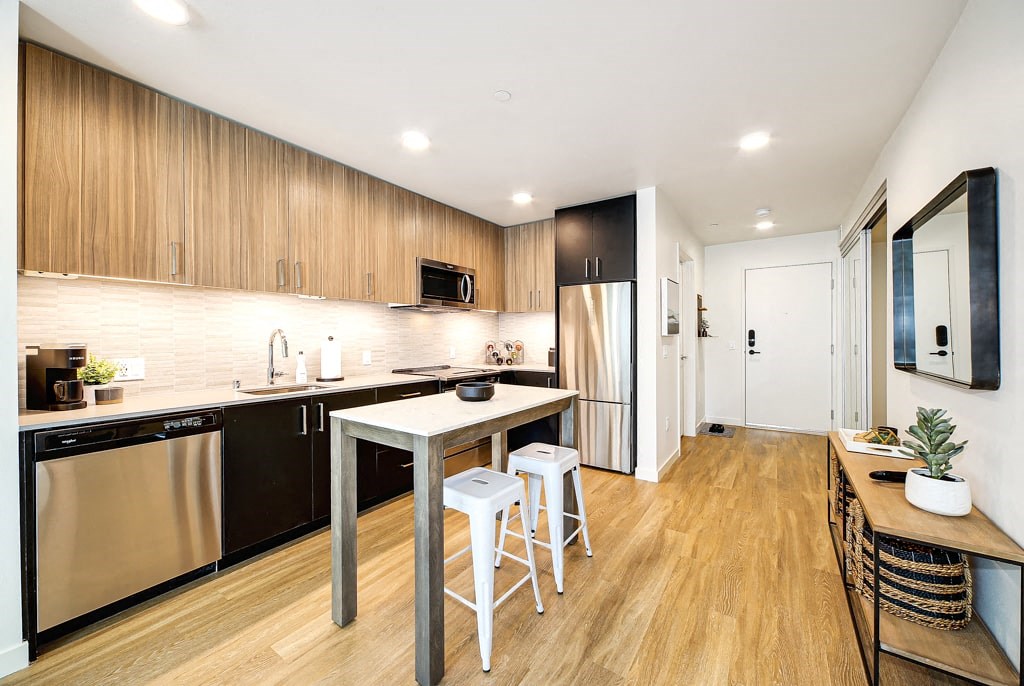 a kitchen with a counter top and a refrigerator