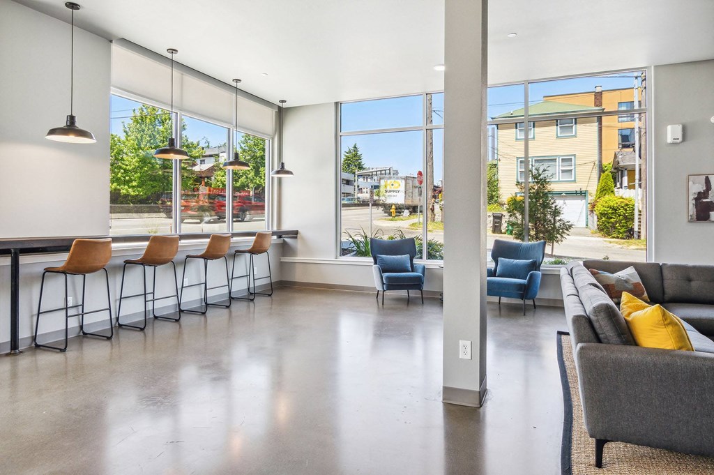 the reserve at bucklin hill clubhouse resident lounge with couches chairs and a bar