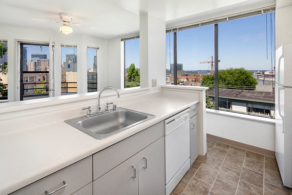 a kitchen with a sink and a window