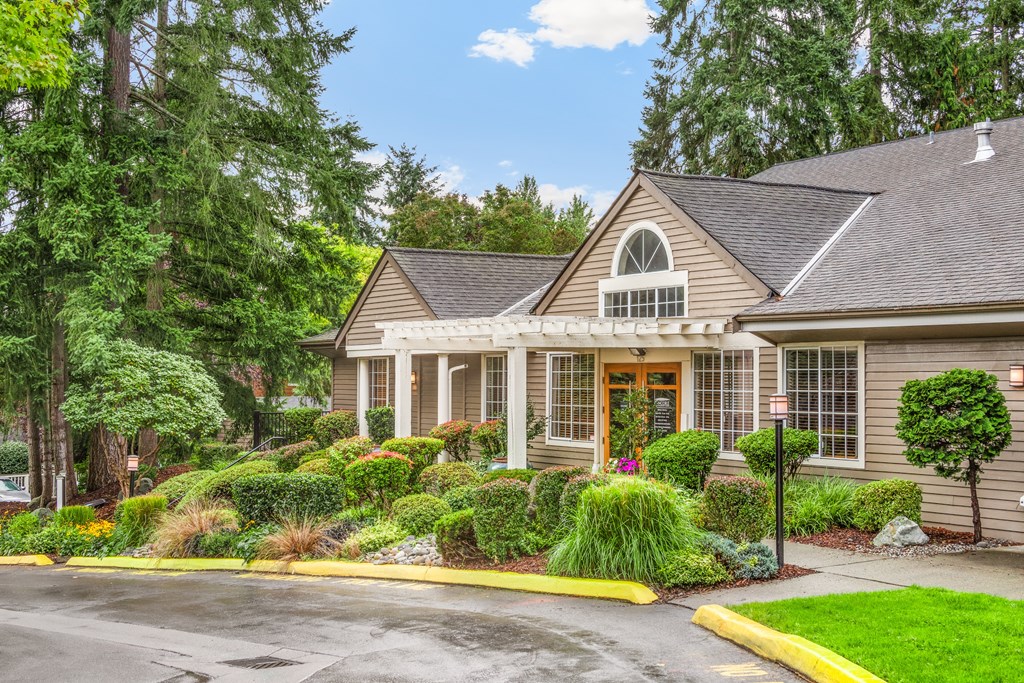 the front of a house with a landscaped front yard
