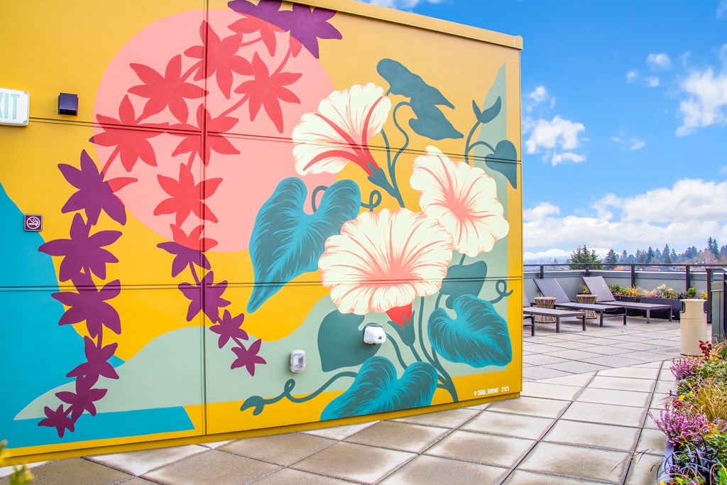 a mural on the side of a building with flowers