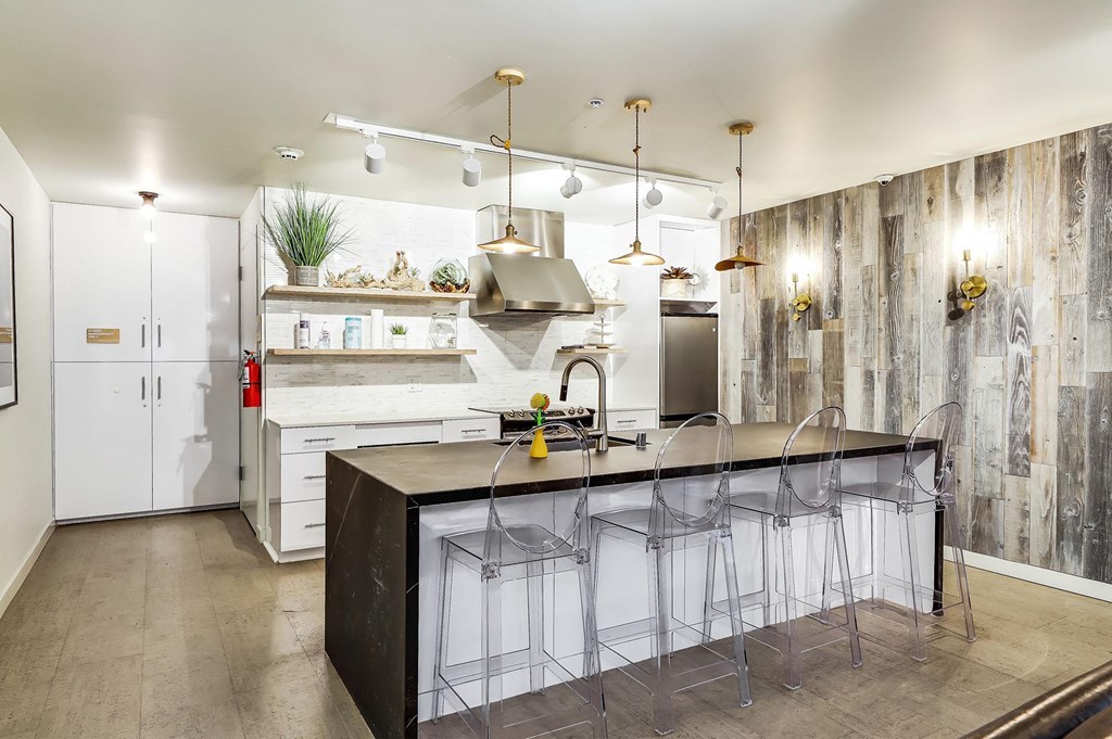 a kitchen with a large island and bar stools