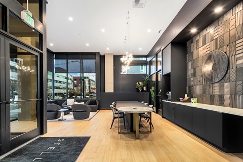 a dining room and living room with a table and chairs