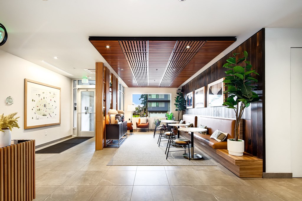 a dining room with a table and chairs in a lobby