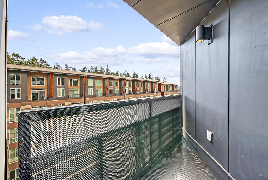 a balcony with a view of a building in the distance
