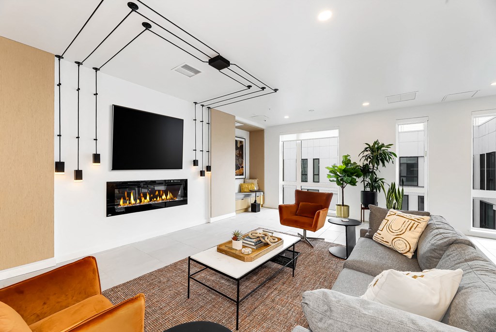 a living room with a fireplace and a television