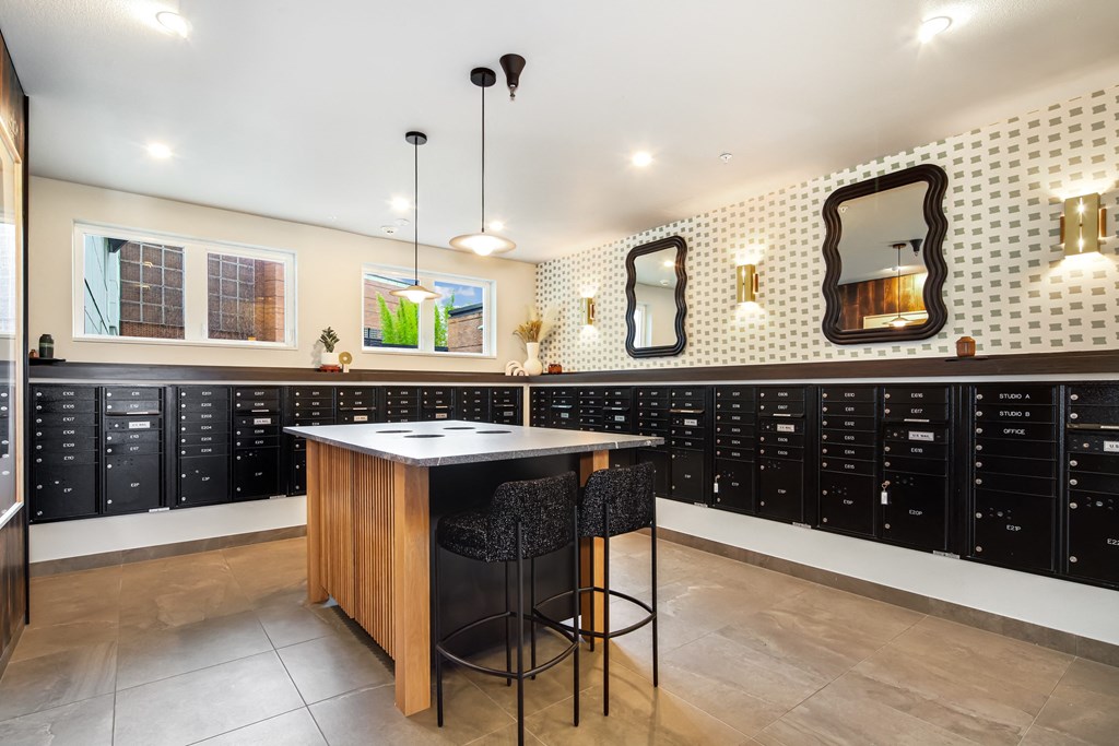 the tasting room has a large selection of wine racks and a bar with stools